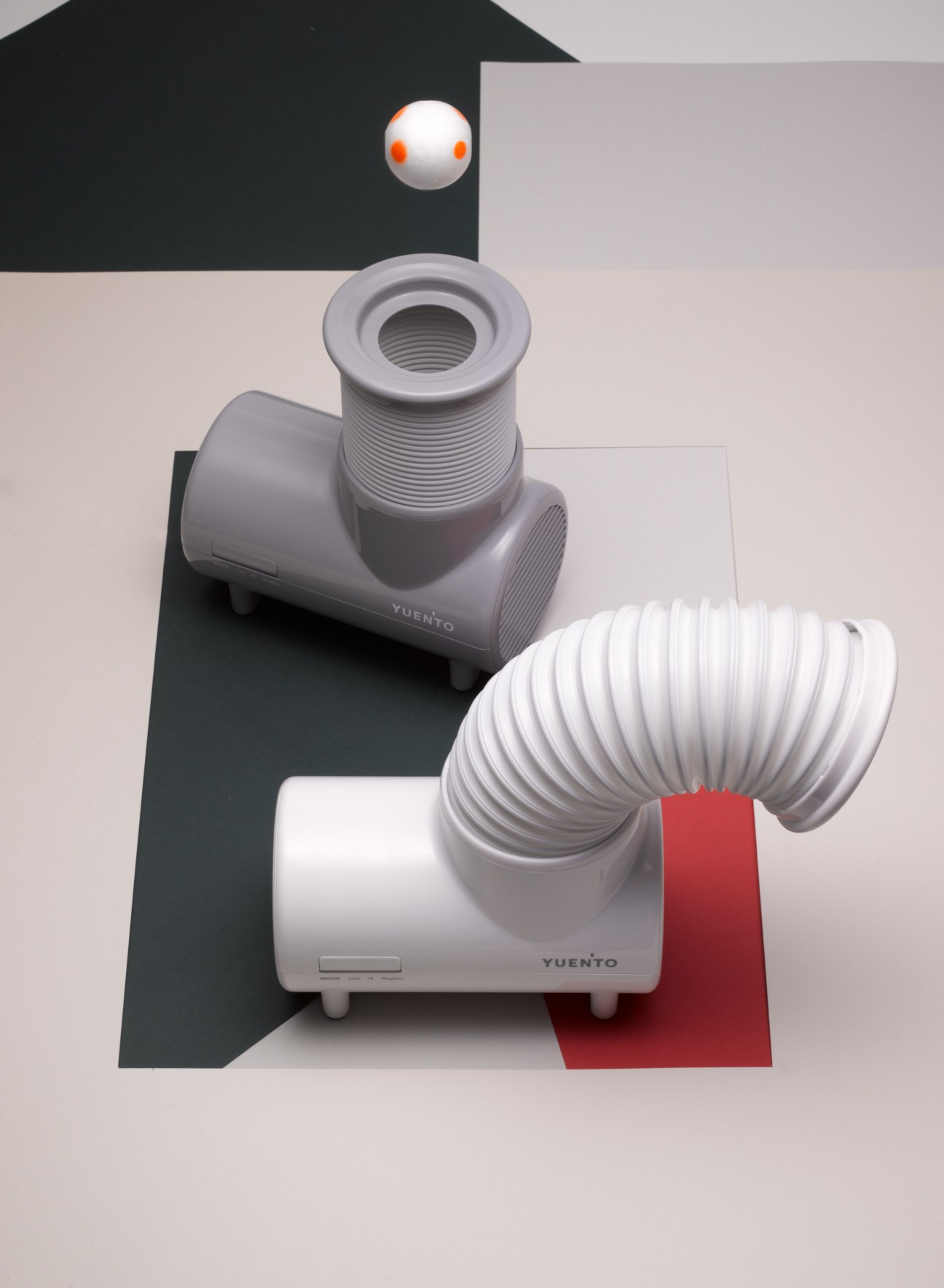 IDEA Mini-Elefan fan with retractable trunk and flexible ducting displayed against geometric shapes.