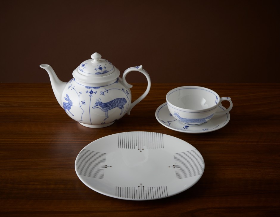Fine bone china teapot, cup and saucer with blue illustrations, and a plate with minimalist line designs by Mira Santo.