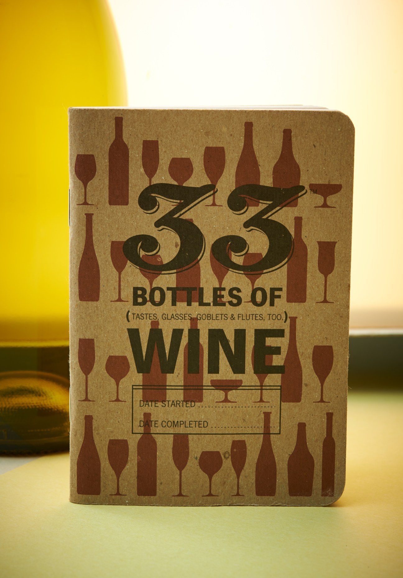 33 Bottles of Wine journal with kraft paper cover and wine bottle and glass illustrations.