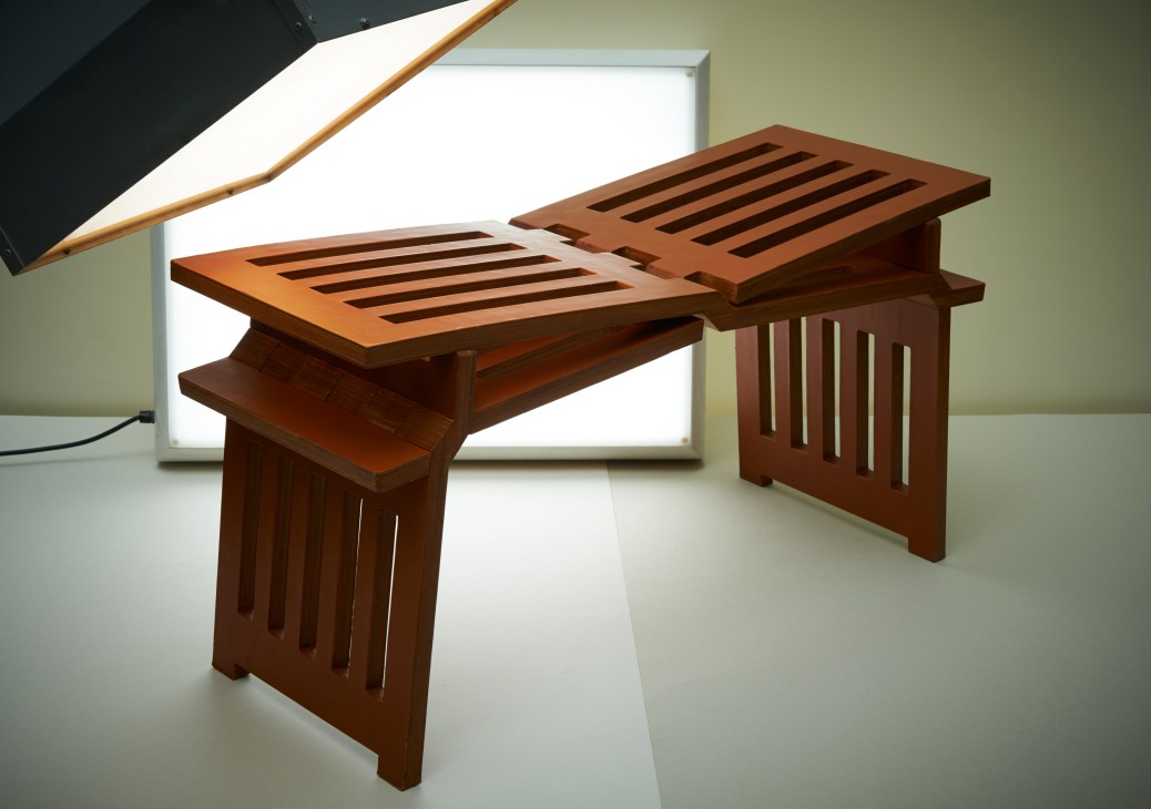 Louis Vuitton Lovebench foldable bench made of leather and wood with slight incline design.