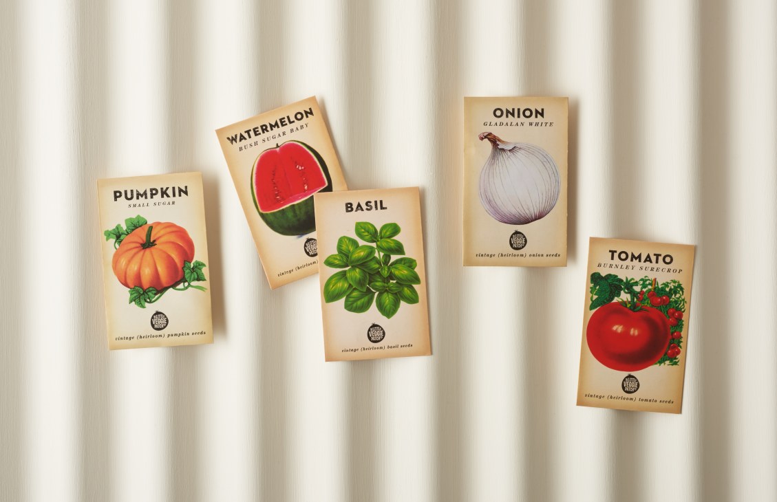 Little Veggie Patch Co seed packets displaying pumpkin, watermelon, basil, onion and tomato varieties.