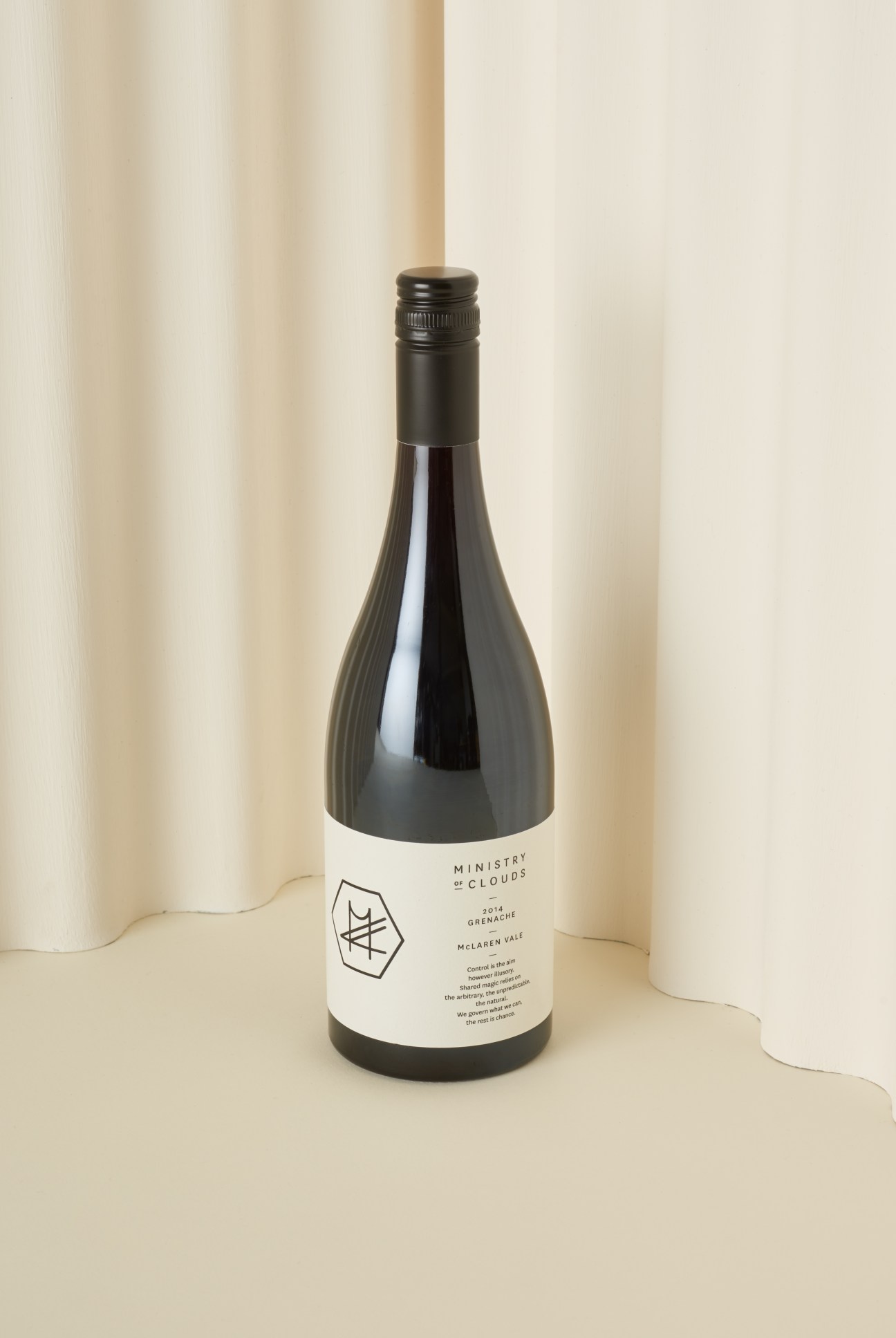Ministry of Clouds wine bottle with minimalist label design against cream background.