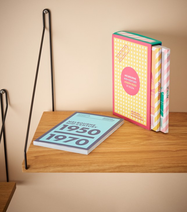 Footpath Guides travel books displayed on wooden shelf, including Melbourne mid-century architecture guide.