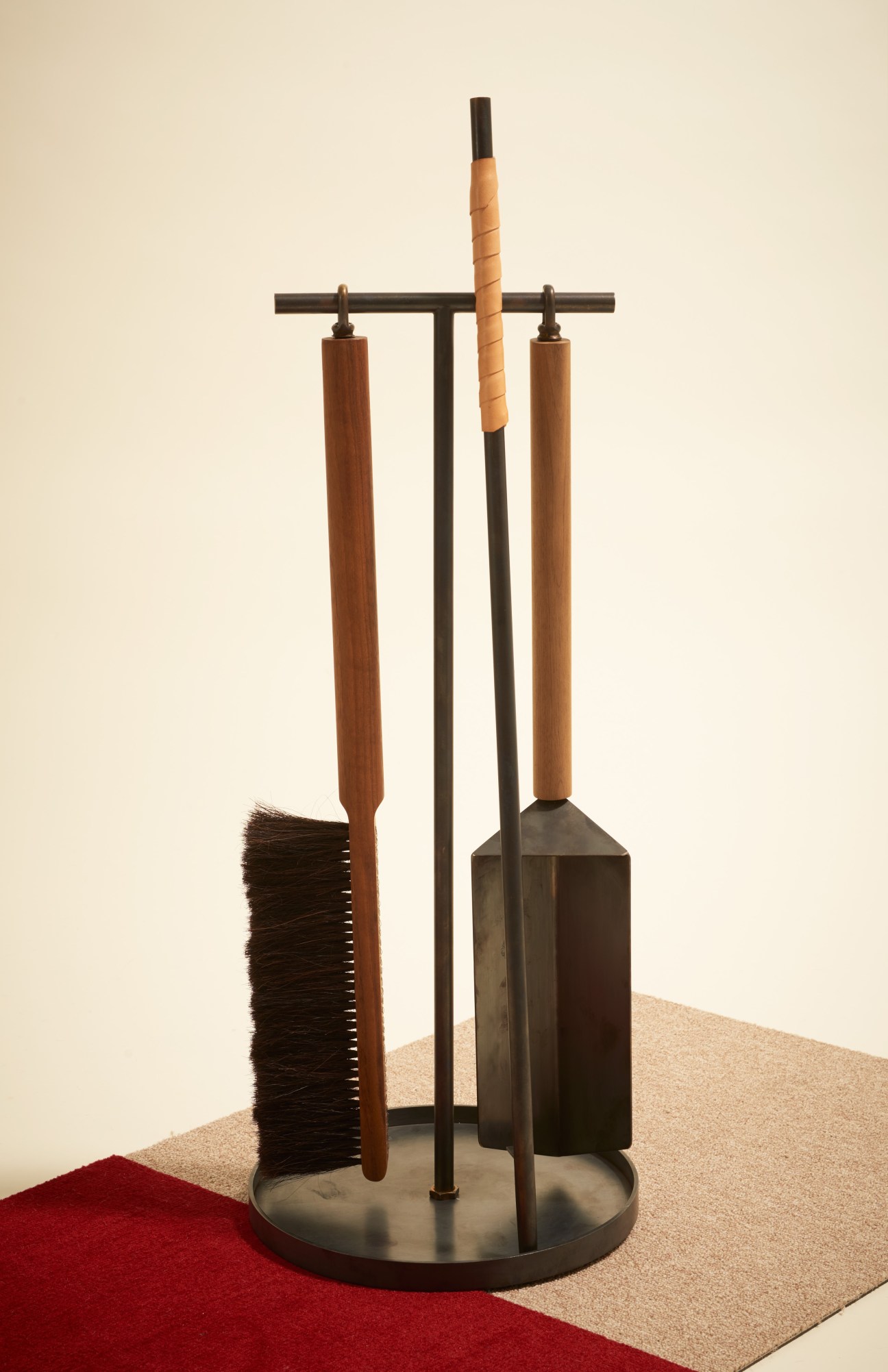 Brass and wood fireplace tool set with poker, brush and dustpan on stand