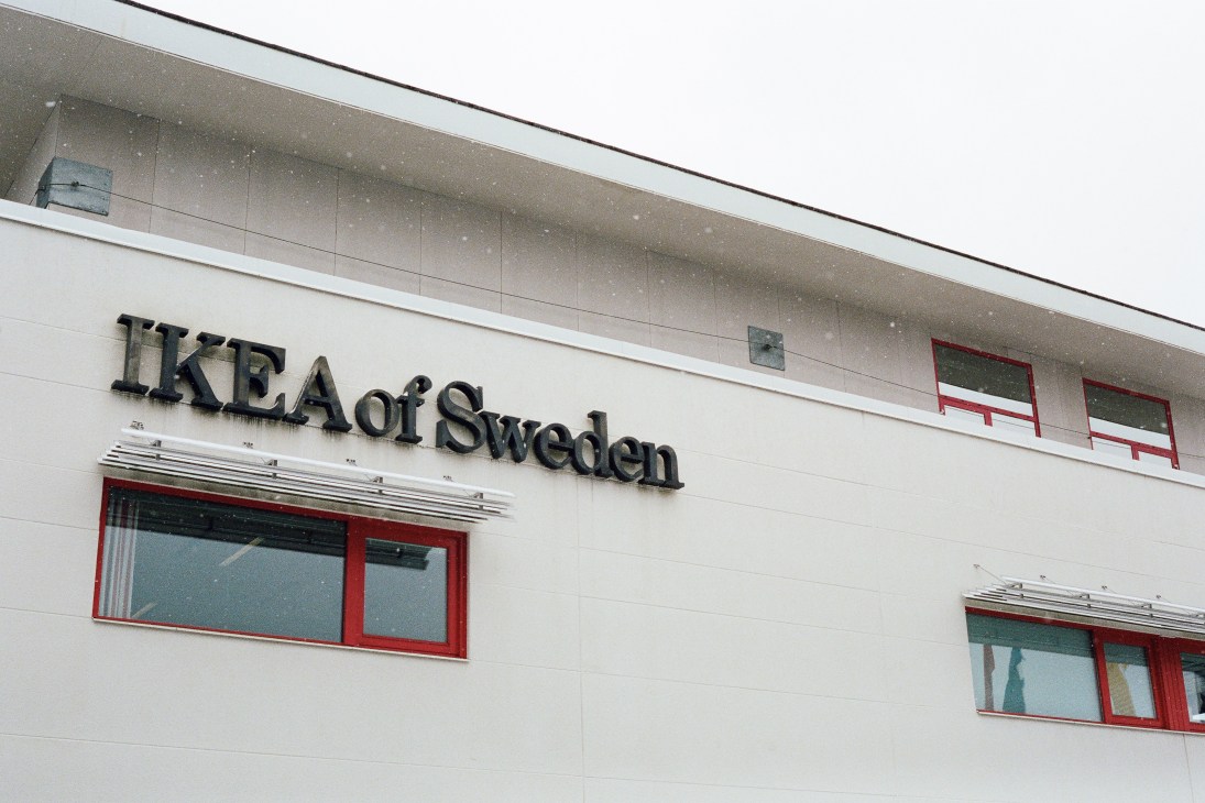 Exterior of Ikea of Sweden headquarters building with signage and red-framed windows.