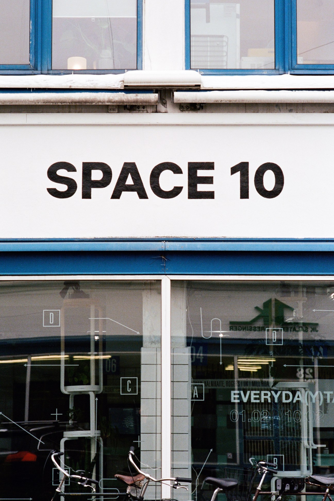 Space10 storefront in Copenhagen with blue-framed windows and signage.