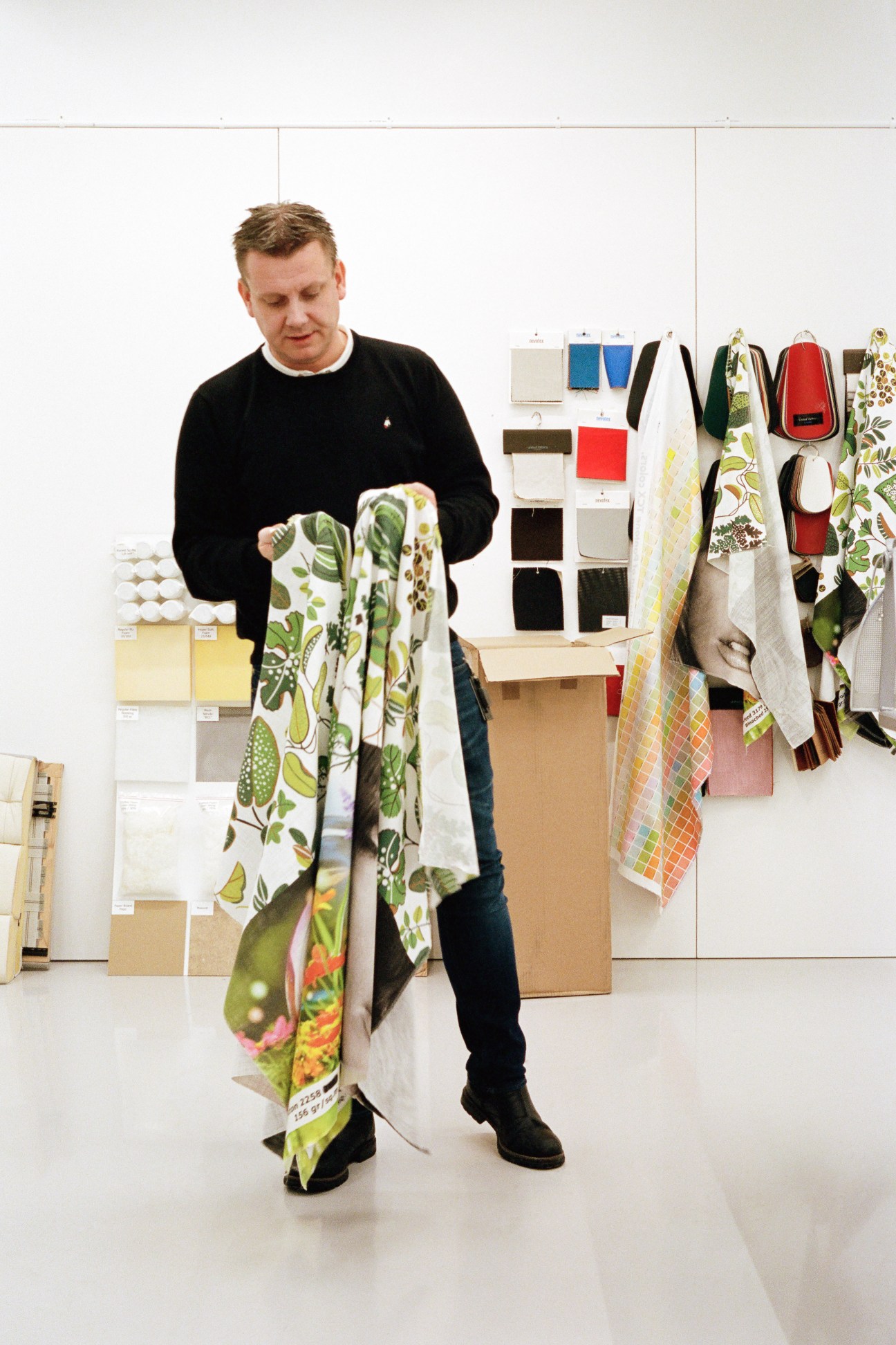Henrik Holmberg, Ikea's head of R&D, examines fabric samples in a design studio.
