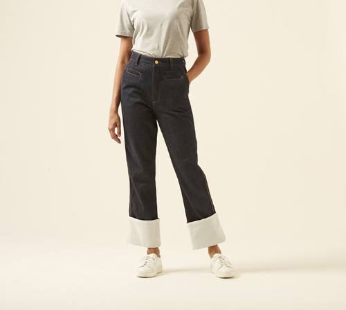 Woman wearing Fisherman jeans by Loewe with wide relaxed fit and light cuffed hem.