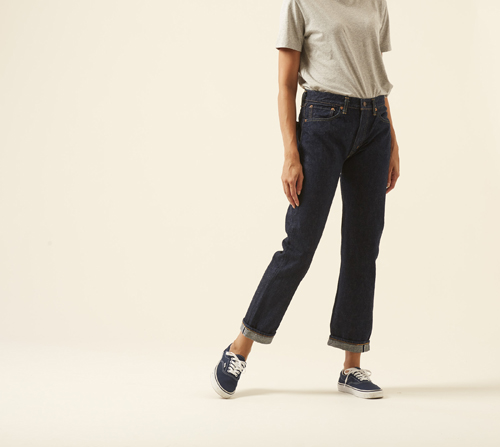 Person wearing Standard 105 jeans by OrSlow in classic straight cut with vintage wash.
