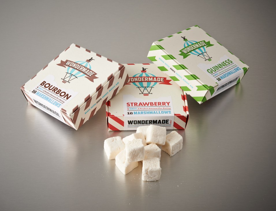 Three Wondermade marshmallow boxes in Bourbon, Strawberry, and Guinness flavours with marshmallows displayed in front.