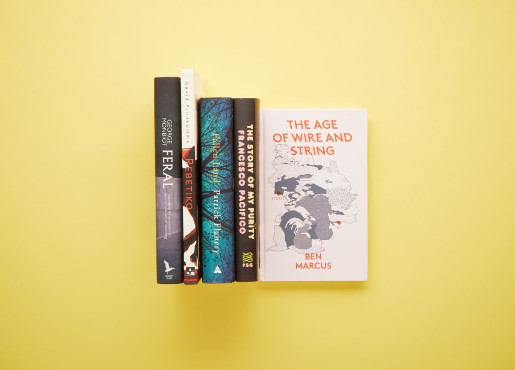 Five books displayed against a yellow background, including Feral, Rebetiko, The Age of Wire and String, and others.