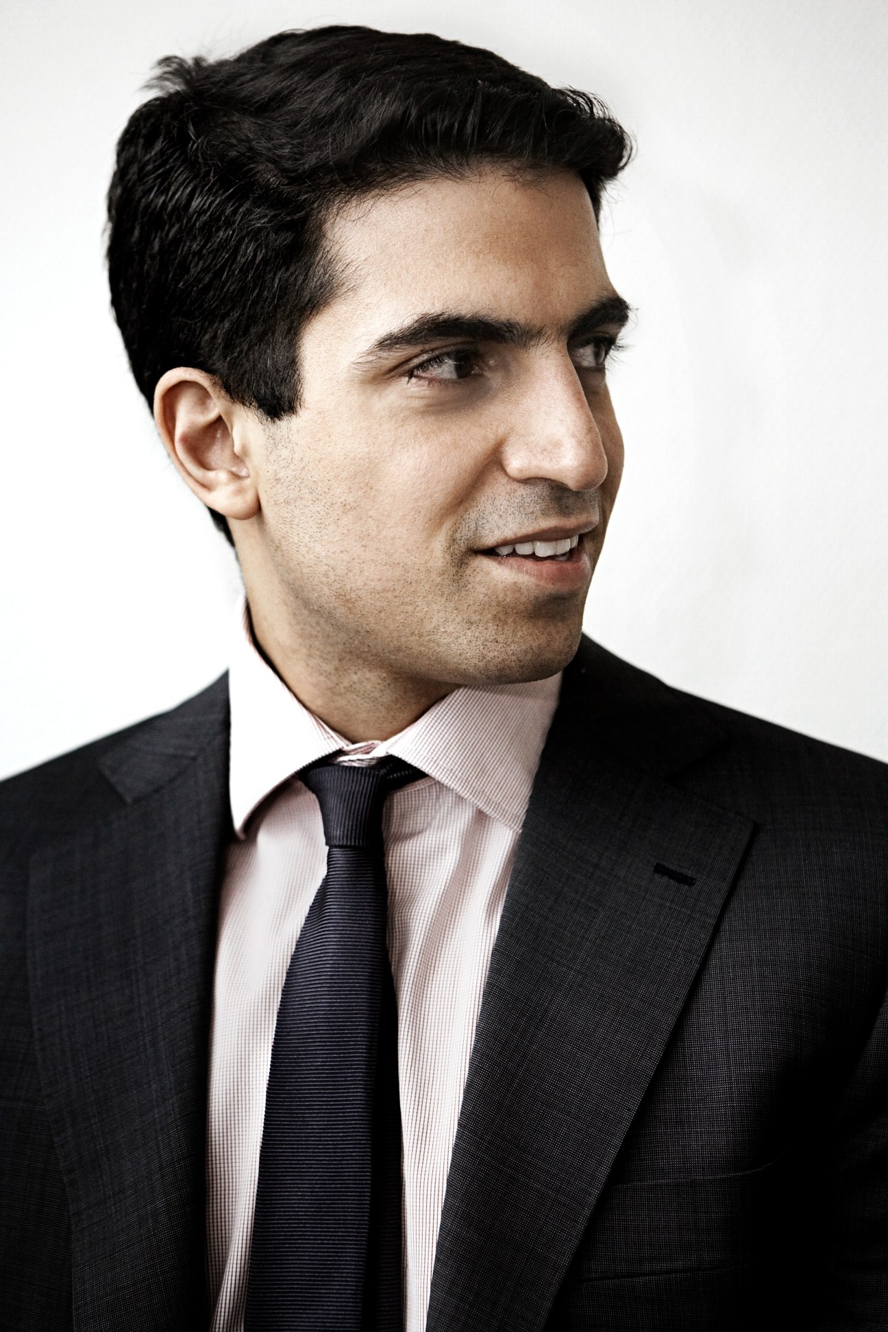 Portrait of Moussa Al Rifai Jr, managing director of Al Rifai, wearing a dark suit and striped tie.