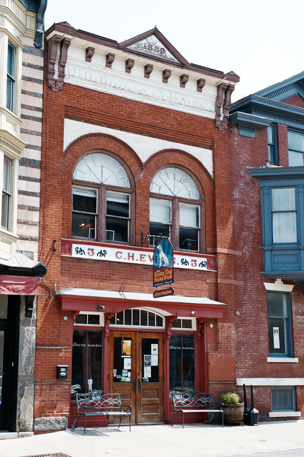 Spotty Dog Books & Ale storefront on Warren Street, a red-brick building with arched windows and signage.