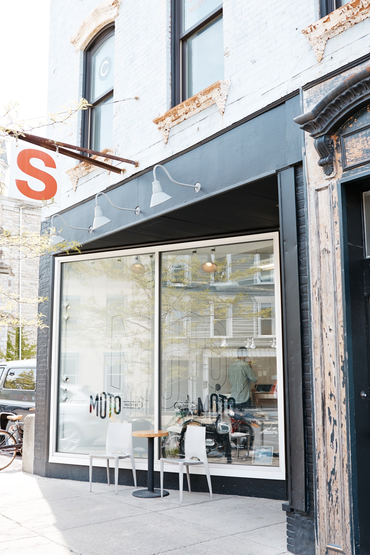 Moto Coffee Machine storefront on Warren Street with large windows and industrial lighting fixtures.