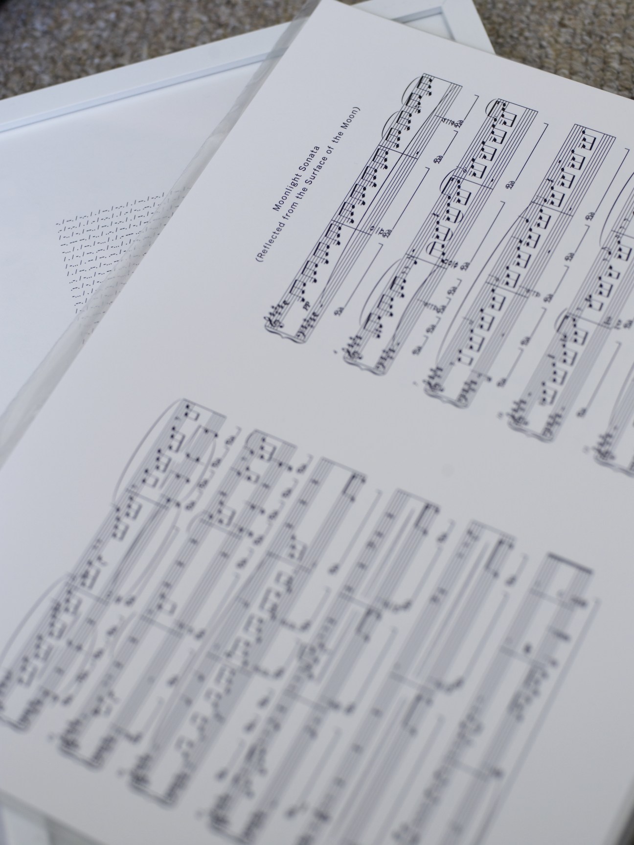 Musical score pages showing Beethoven's Moonlight Sonata with missing notes from Katie Paterson's moon-bounce art project.