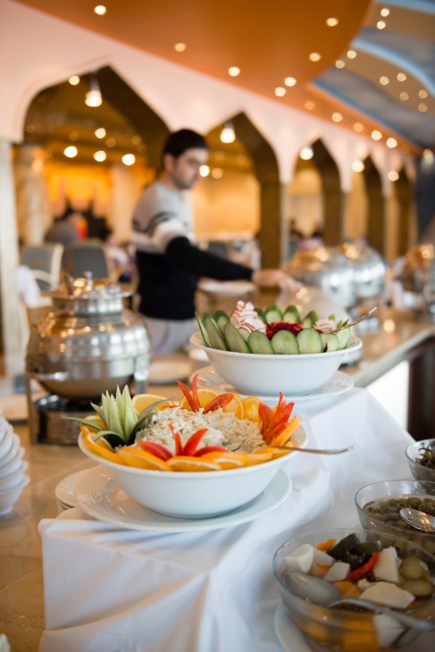 Buffet lunch spread with fresh vegetables and dishes at InterContinental Kabul hotel.