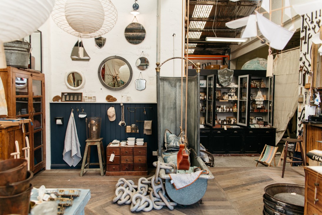 Interior of The Society Inc design studio and shop in Sydney featuring maritime-inspired homeware, mirrors, and decorative objects.