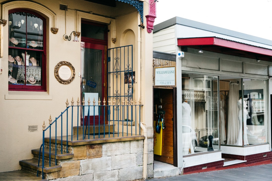 Victorian terrace buildings and shop fronts on William Street in Sydney's Paddington district.