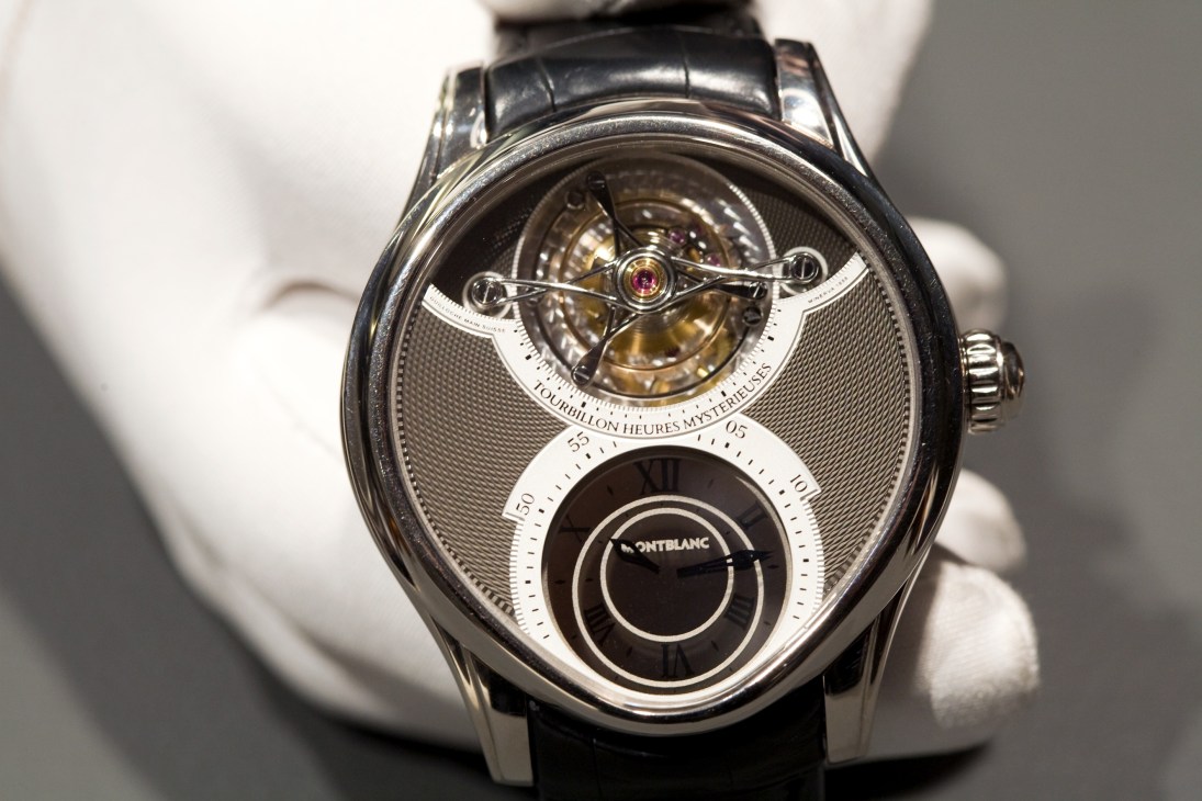Montblanc Grand Tourbillon Heures Mystérieuses watch with visible tourbillon mechanism and dual subdials on leather strap.