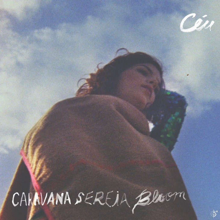 Album cover for Caravana Sereia Bloom by Céu featuring a person against a blue sky.