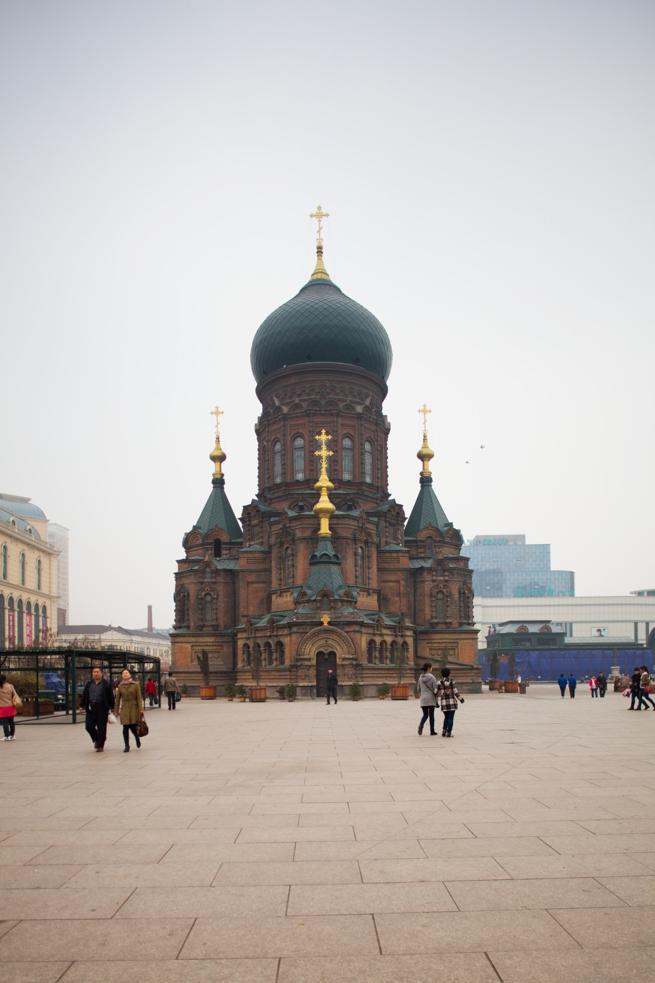 St Sophia Cathedral's ornate Russian Orthodox architecture with blue onion dome and golden crosses in Harbin.