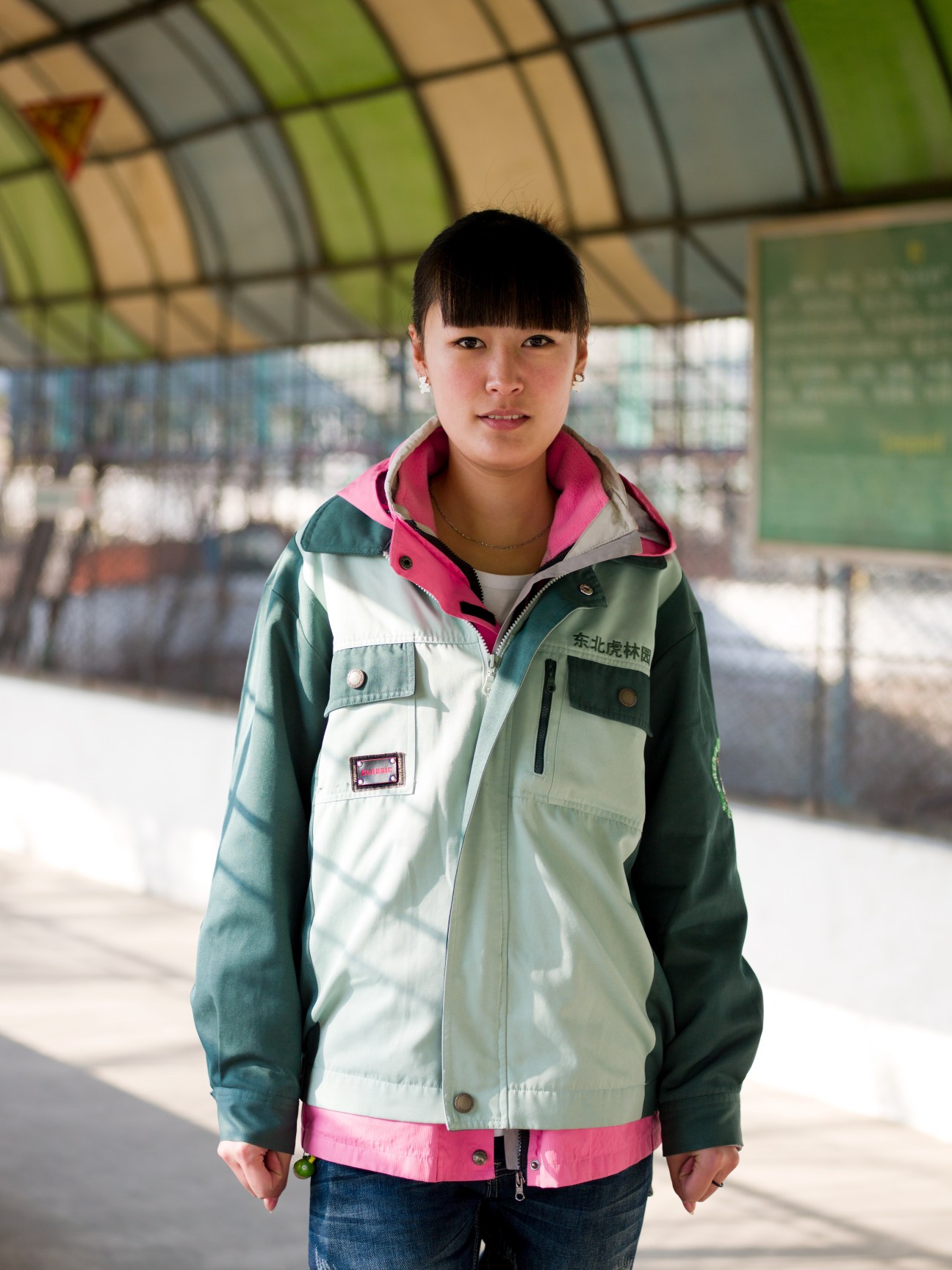 Tiger park tour guide wearing colorful jacket at Northeast Siberian Tiger Sanctuary in Harbin.