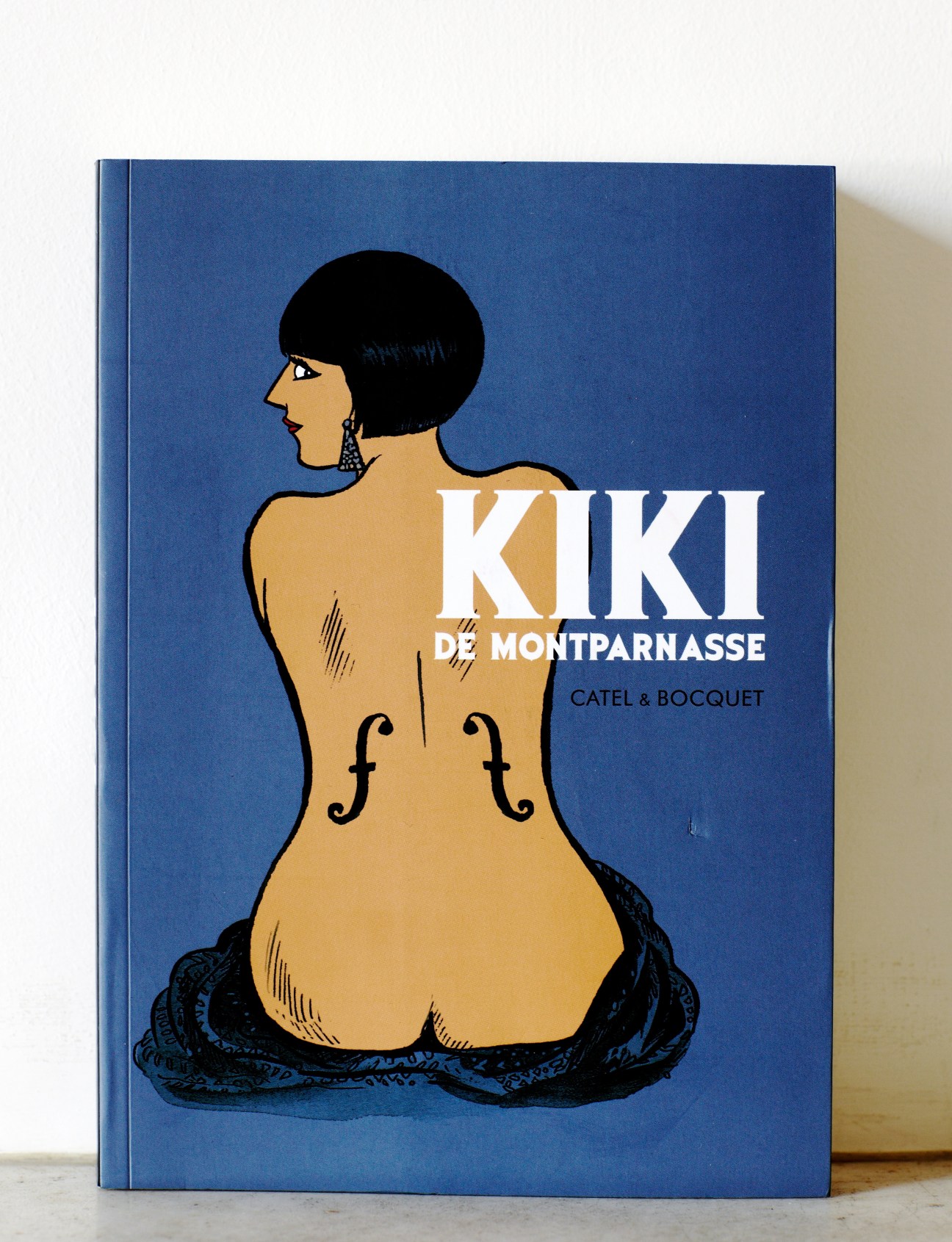 Kiki de Montparnasse graphic novel cover with illustrated figure and blue background