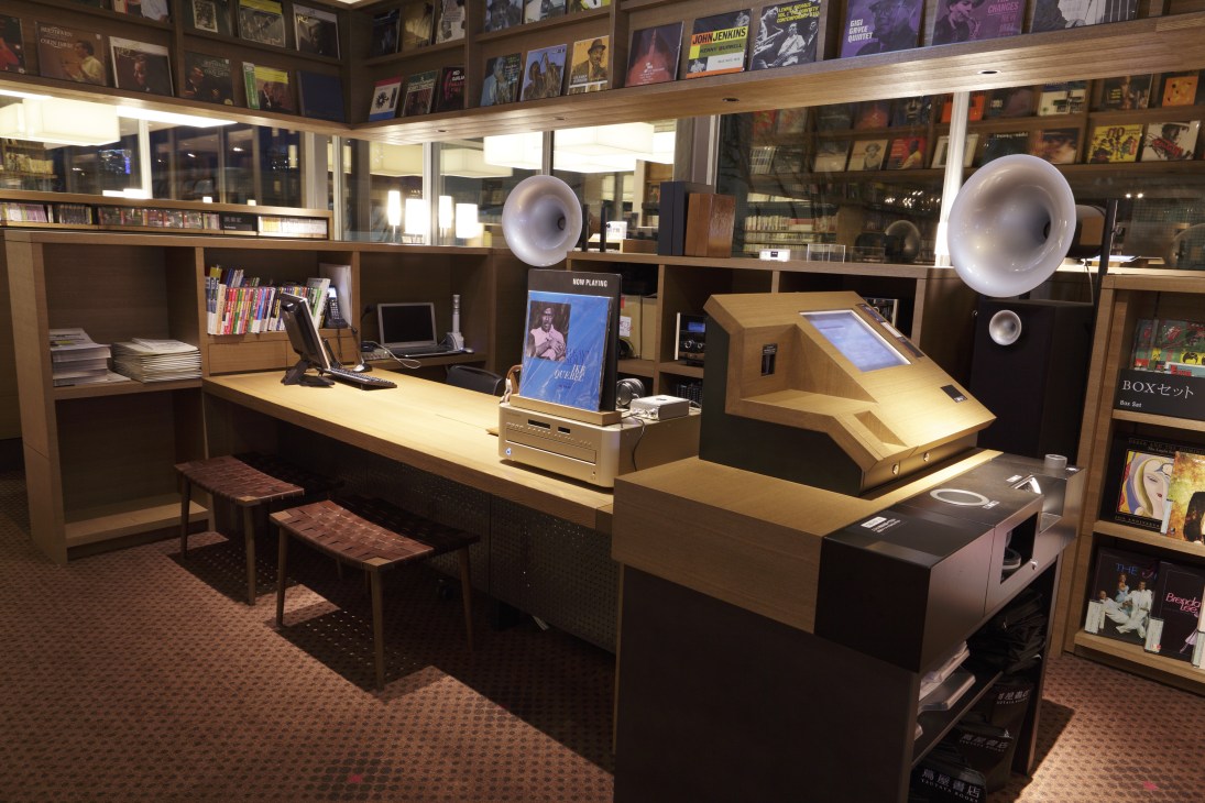 Jazz section with wooden display counter, McIntosh audio equipment, vinyl records, and listening stations.