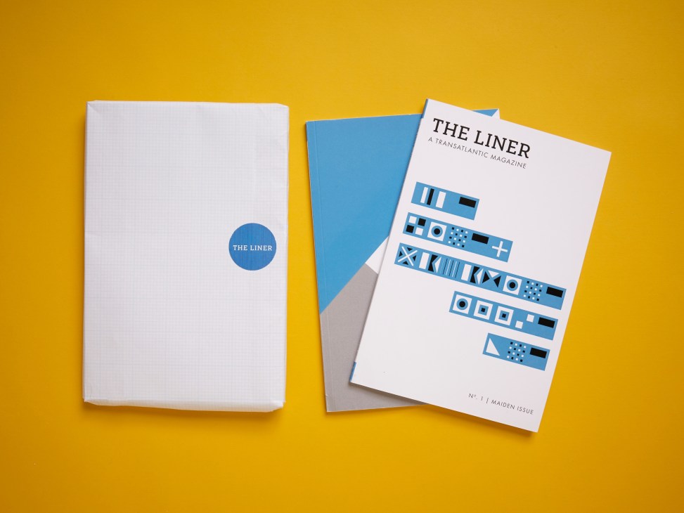 The Liner magazine cover and packaging displayed against a yellow background, showing minimalist blue design.