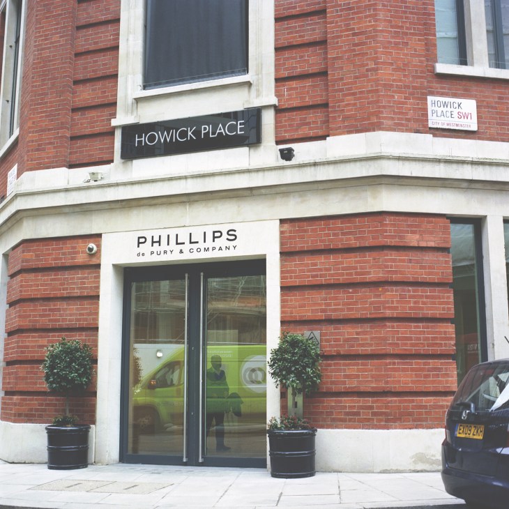 Phillips de Pury & Company storefront on Howick Place in London's red brick building.