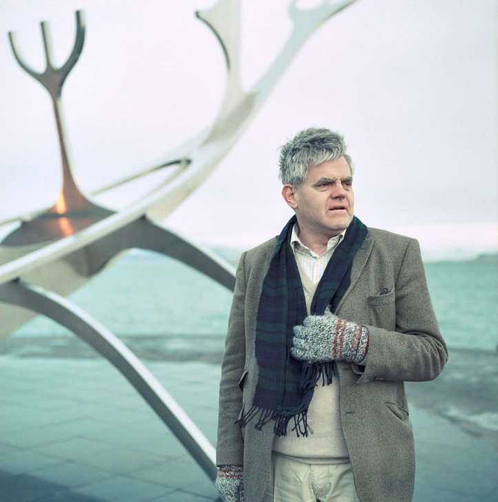 Orri Vigfusson, environmentalist and founder of the North Atlantic Salmon Fund, stands by a boat in Iceland.