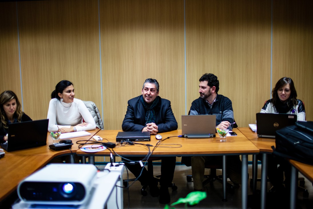 Oskar Goitia and colleagues sit at a conference table during a meeting at Mondragón co-operative.
