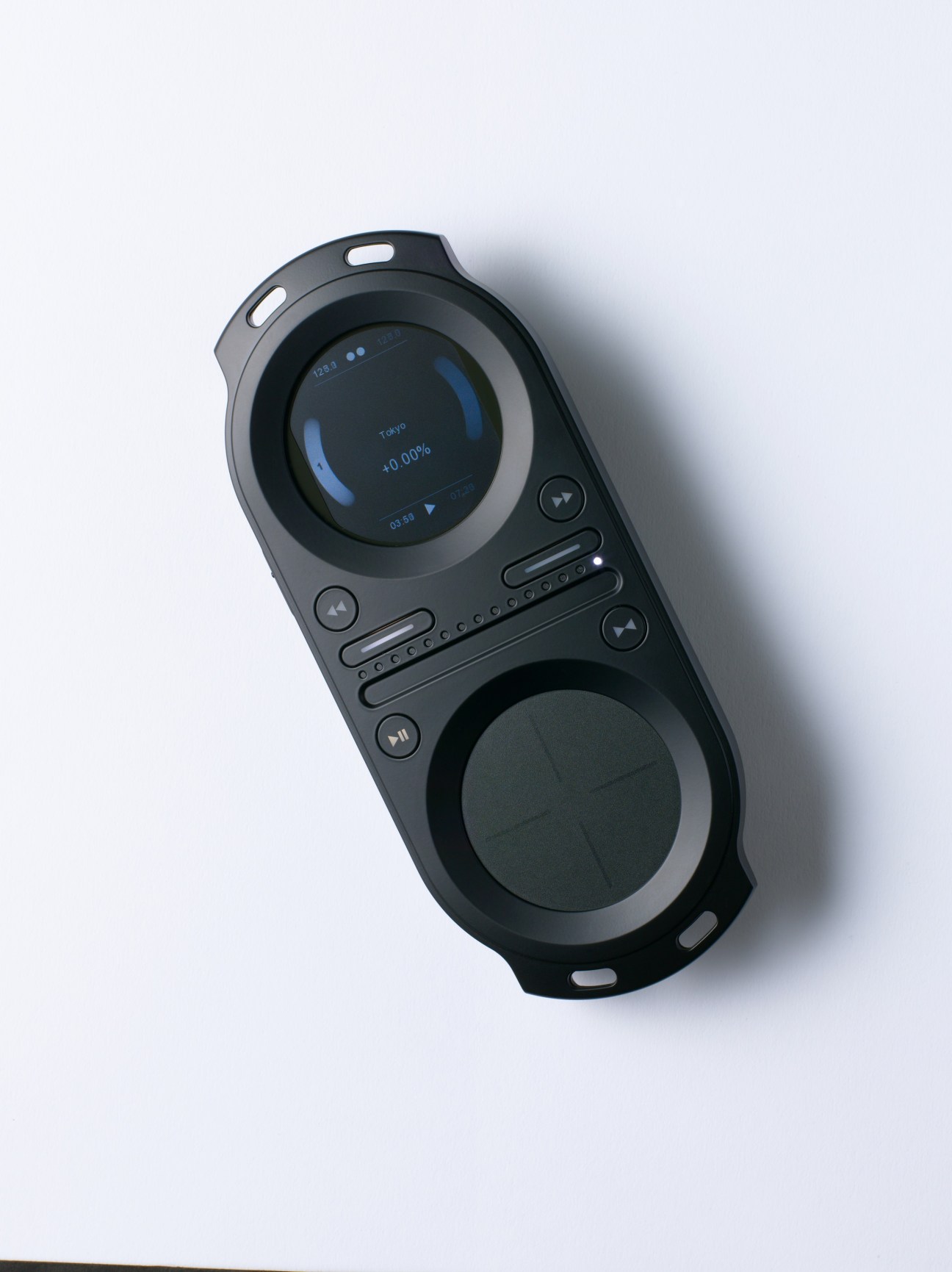Tonium Pacemaker portable DJ device with dual jog wheels, LCD display and control buttons.
