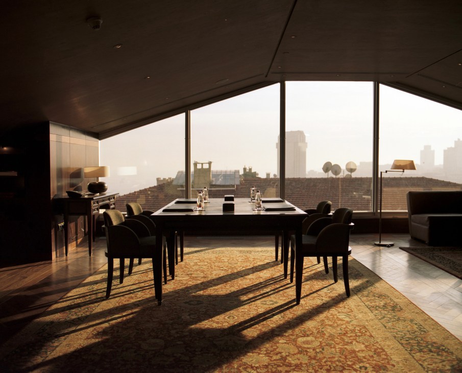 Park Hyatt Istanbul presidential dining suite with floor-to-ceiling windows overlooking Istanbul cityscape.