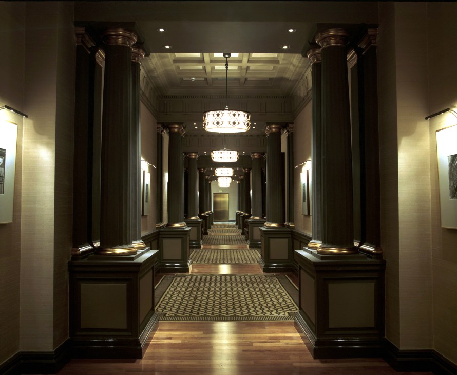 Park Hyatt Istanbul's symmetrical main lobby with columns, coffered ceiling and pendant lights.