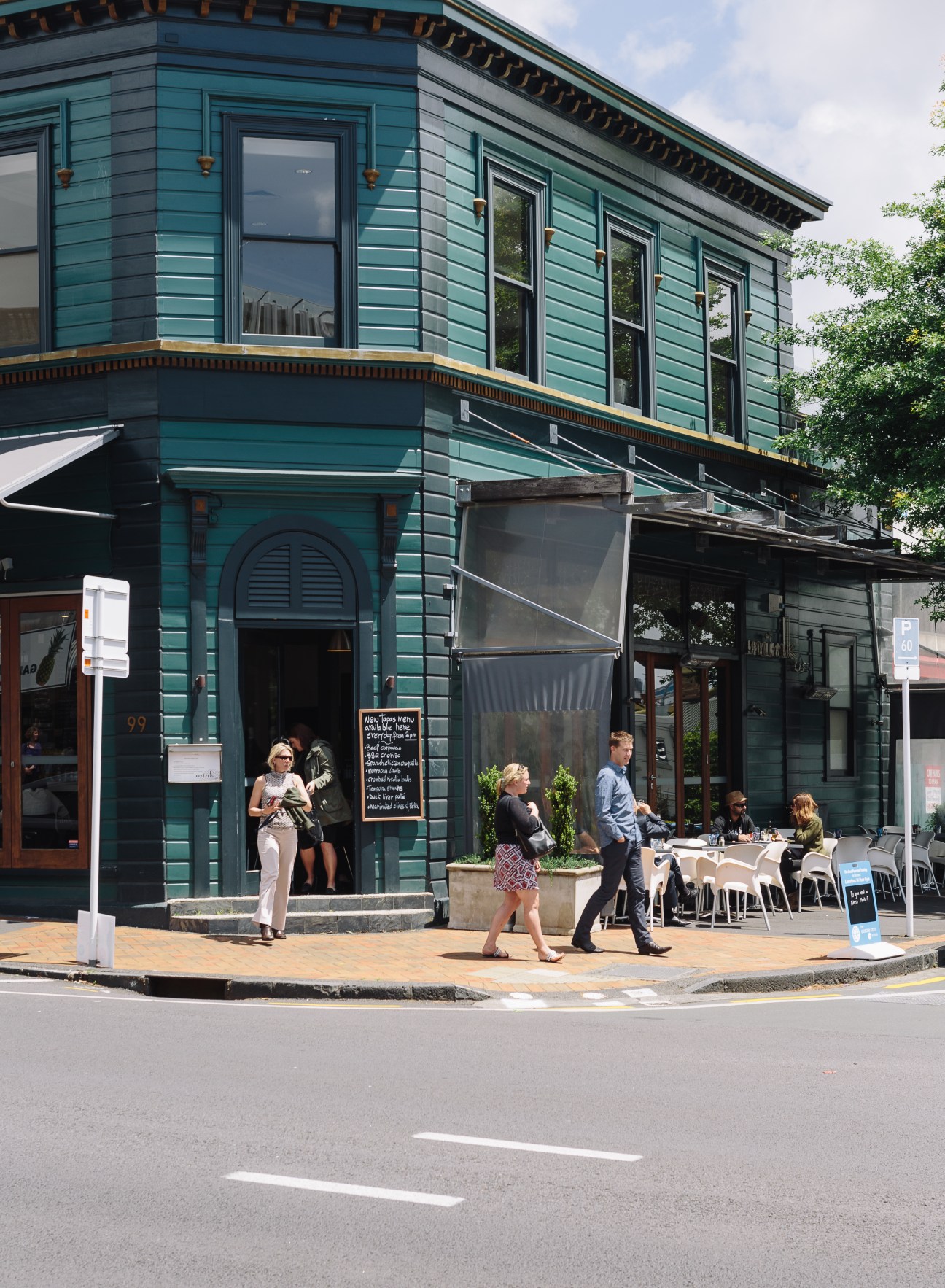 Teal colonial-era building with outdoor café seating on Parnell Road in Auckland.