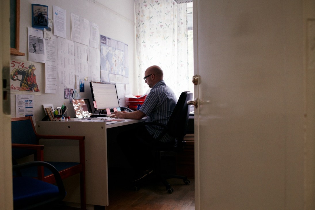 Paul Holtom, director of the Arms Transfers Programme, works at his desk in his office at SIPRI.