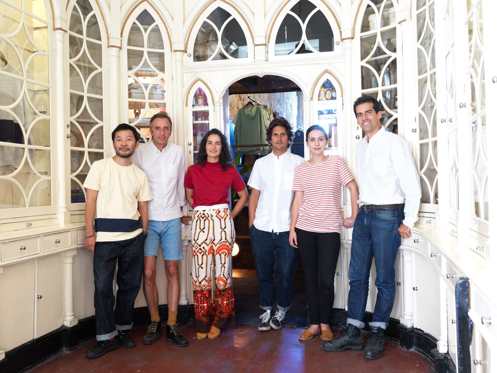 André Bastos Teixeira and Jose Miguel de Abreu with friends inside La Paz's flagship shop in Porto's Ribeira district.