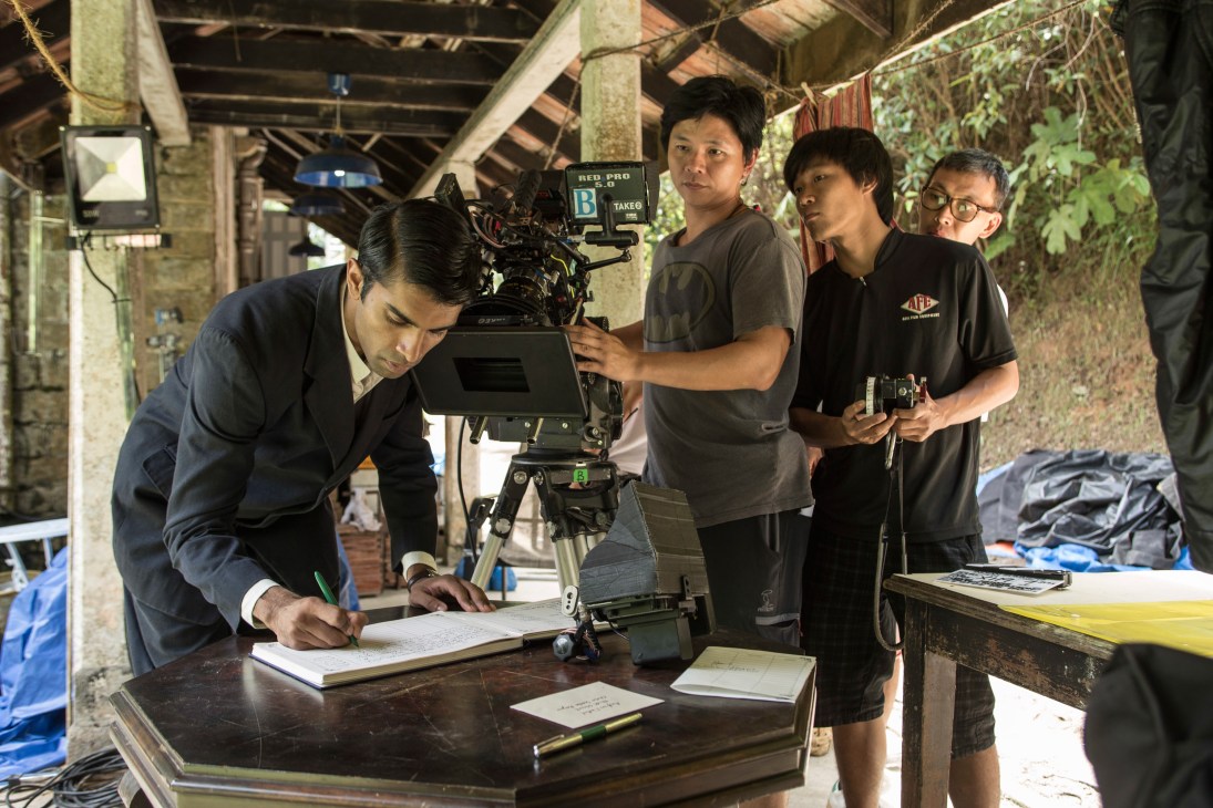 Crew members on the set of Indian Summers, with a cameraman operating a RED camera while others monitor the shot.