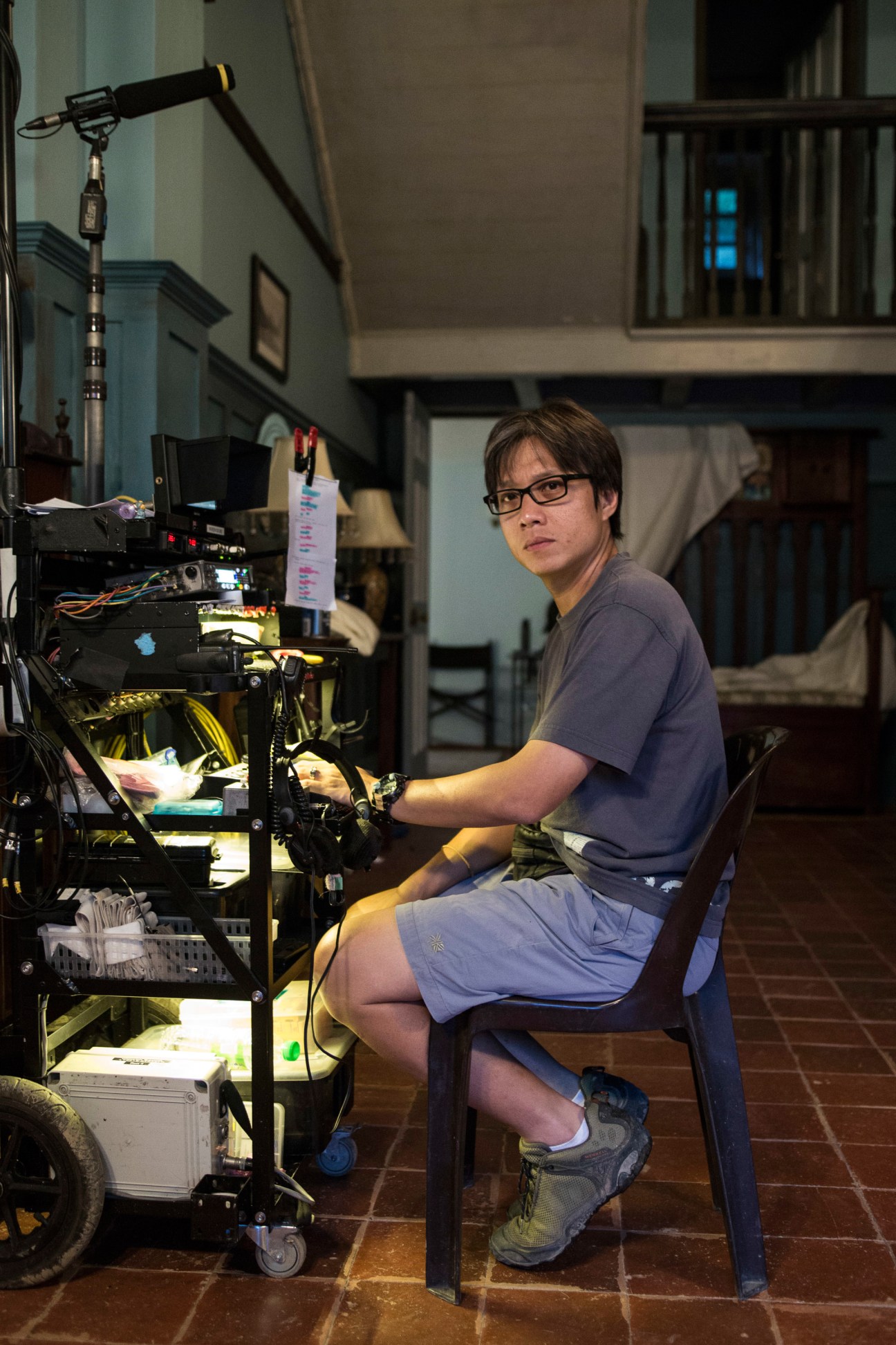 Sound technician operating equipment at on-set sound desk during Indian Summers production.