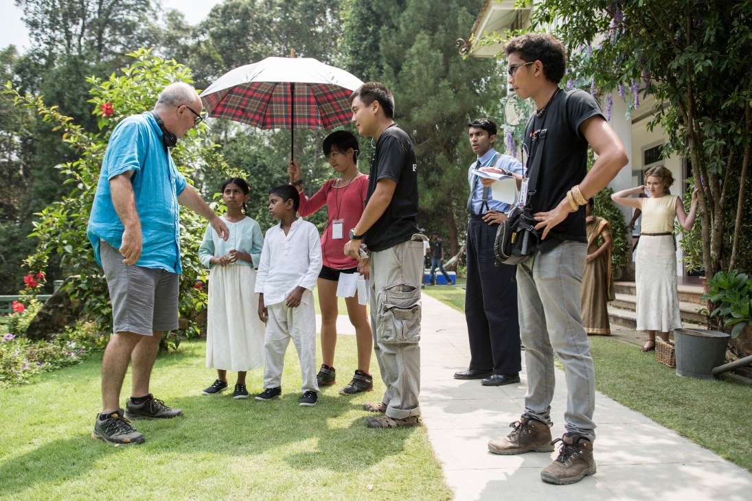 Film crew and extras on the set of Indian Summers at Woodside house in Penang, Malaysia.