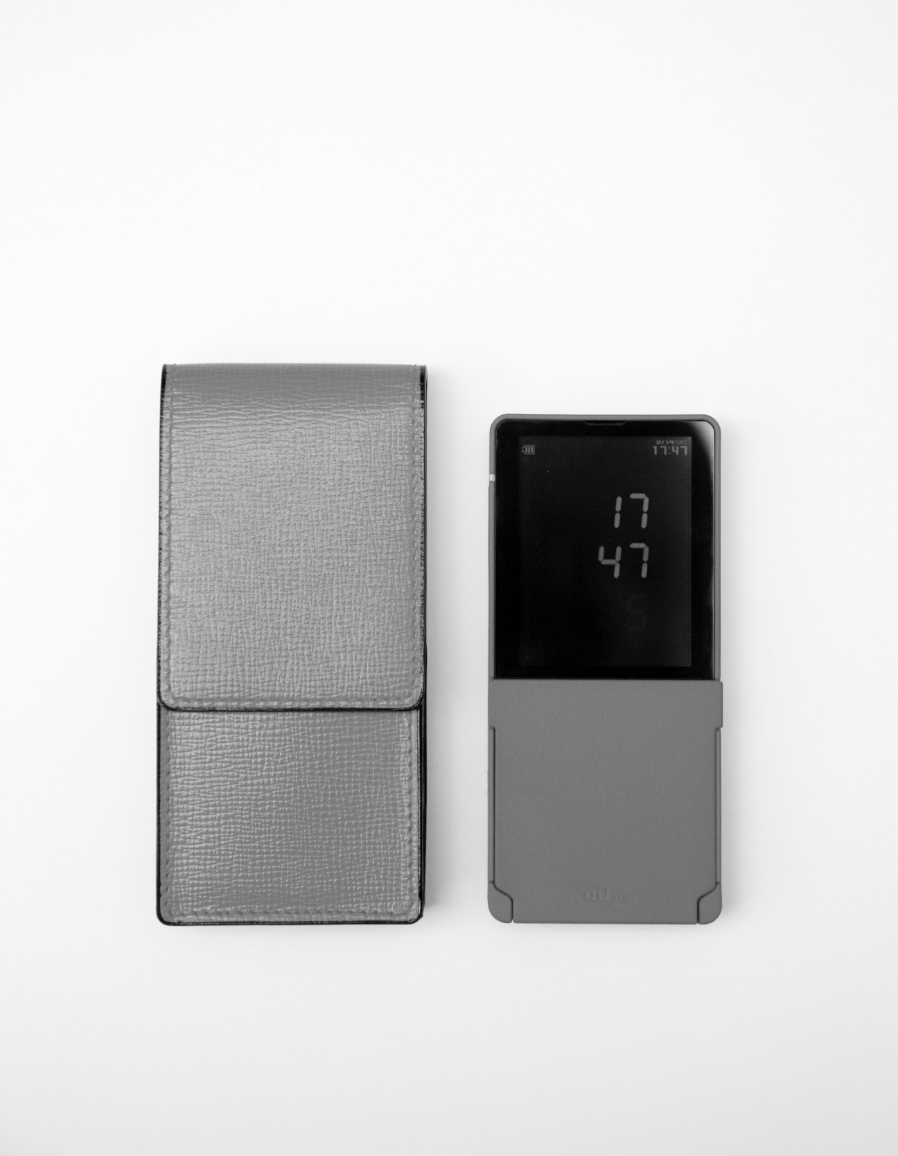 Media Skin mobile phone by Tokujin Yoshioka with metallic finish and matching Valextra leather case.
