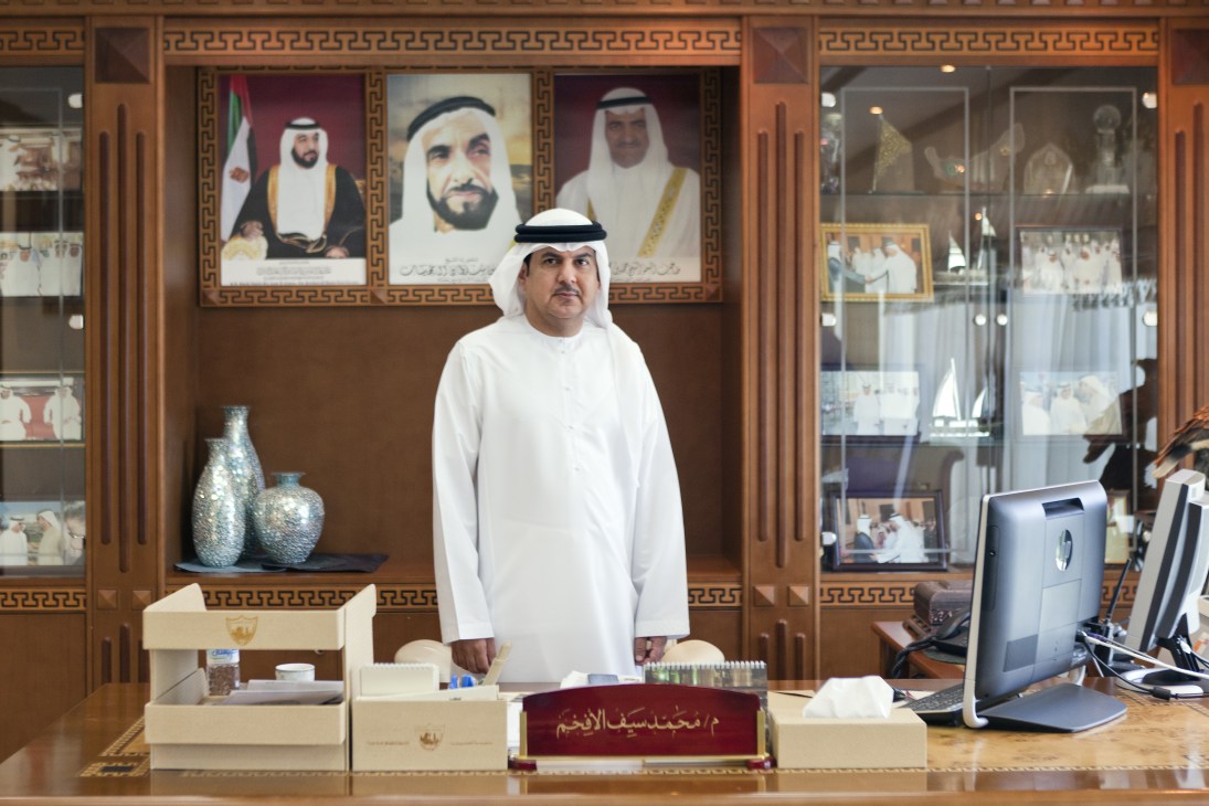 Mohammed Saif Al Afkham, director general of Fujairah Municipality, stands at his desk in his office.