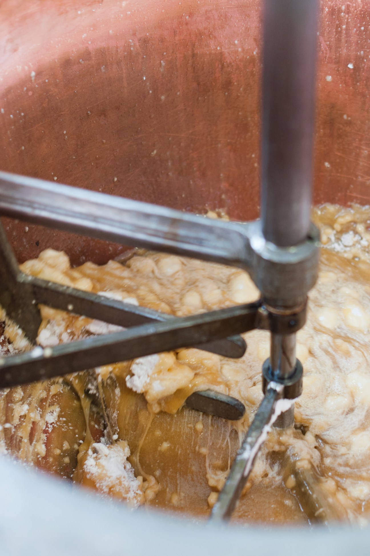 Close-up of nougat mixture being heated in copper vats at Scaldaferro factory.