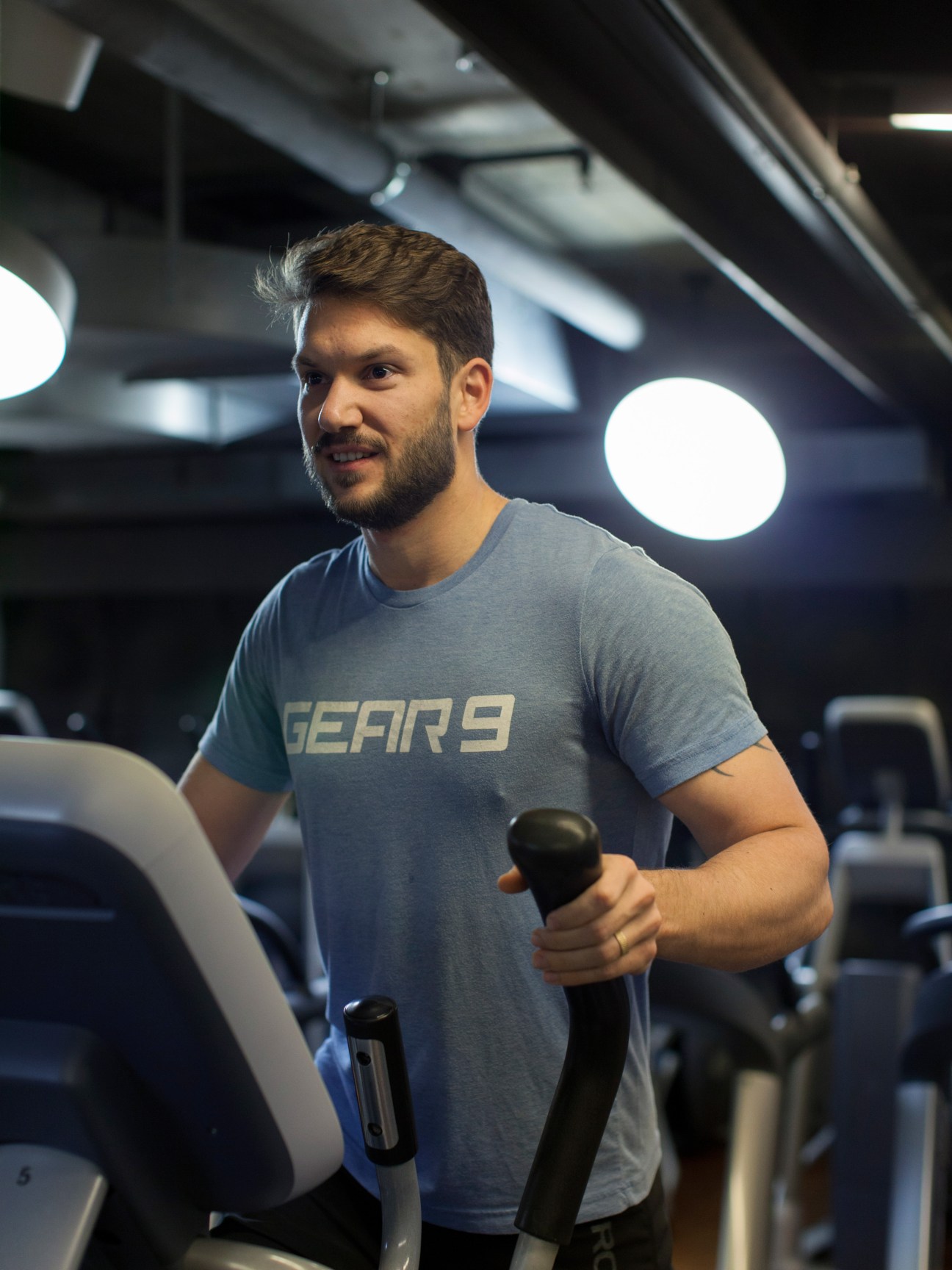 Man exercising on cardio equipment at Migros Fitnesspark Puls 5 in Zurich