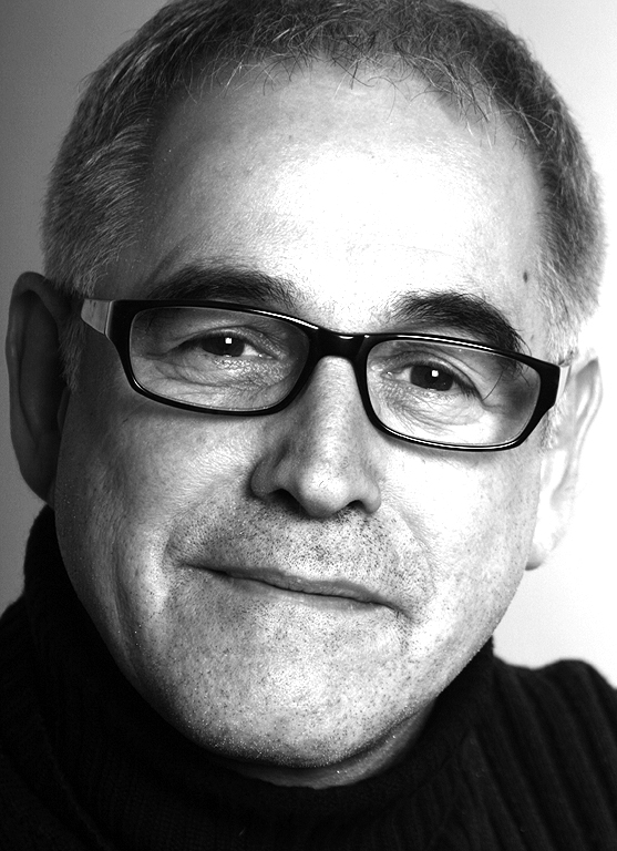 Black and white portrait of Michael Braum, head of the Federal Foundation for Building Culture in Berlin, wearing glasses.