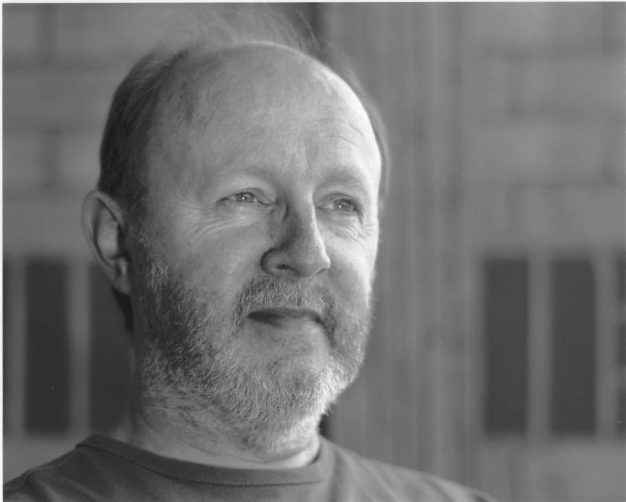 Black and white portrait photograph of Peter Doggett, author of The Man Who Sold The World.