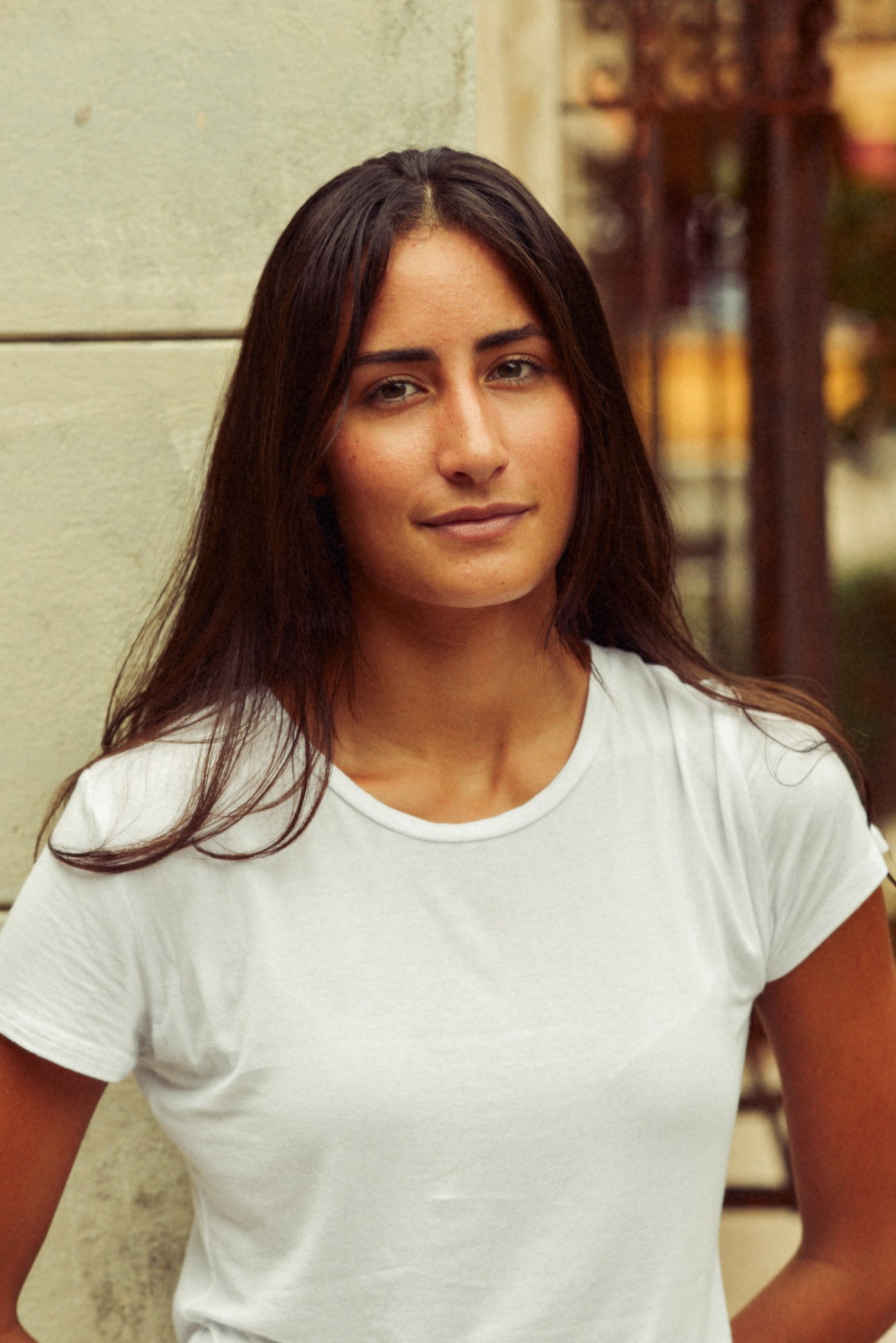 Portrait of painter and installation artist Rachel Valdés Camejo wearing a white t-shirt.