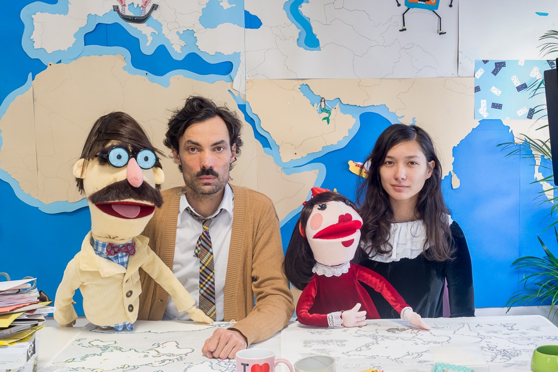 Benjamin Moreau and Noemi Ferst pose with handmade puppet mascots Françoise and Jean Pierre at Radiooooo studios.