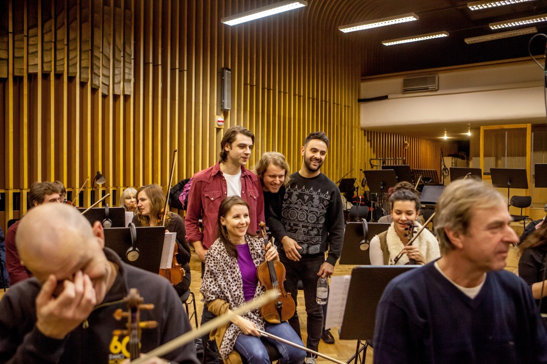 British band Rale members interact with Czech National Symphony Orchestra musicians during a recording session in Prague.